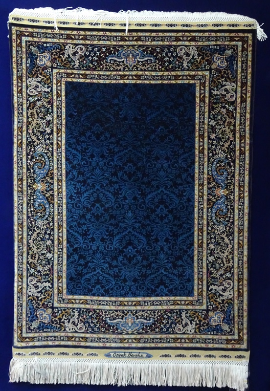 Blue and gold silk rug