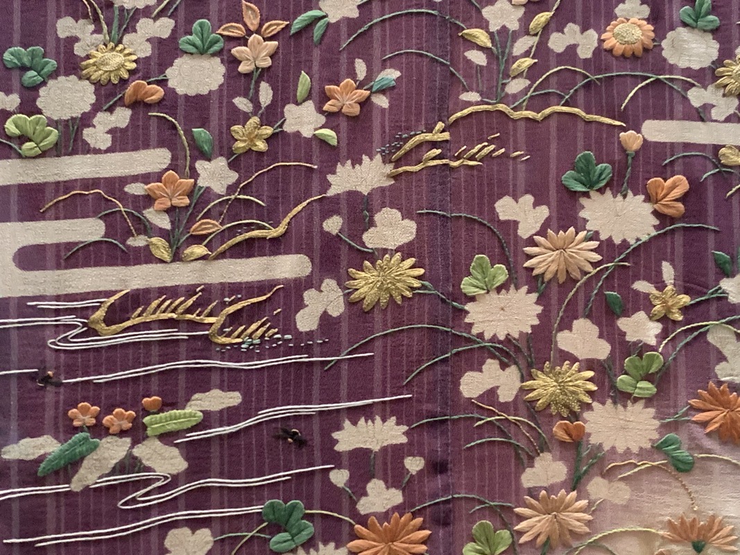 resist dyed and embroidered detail